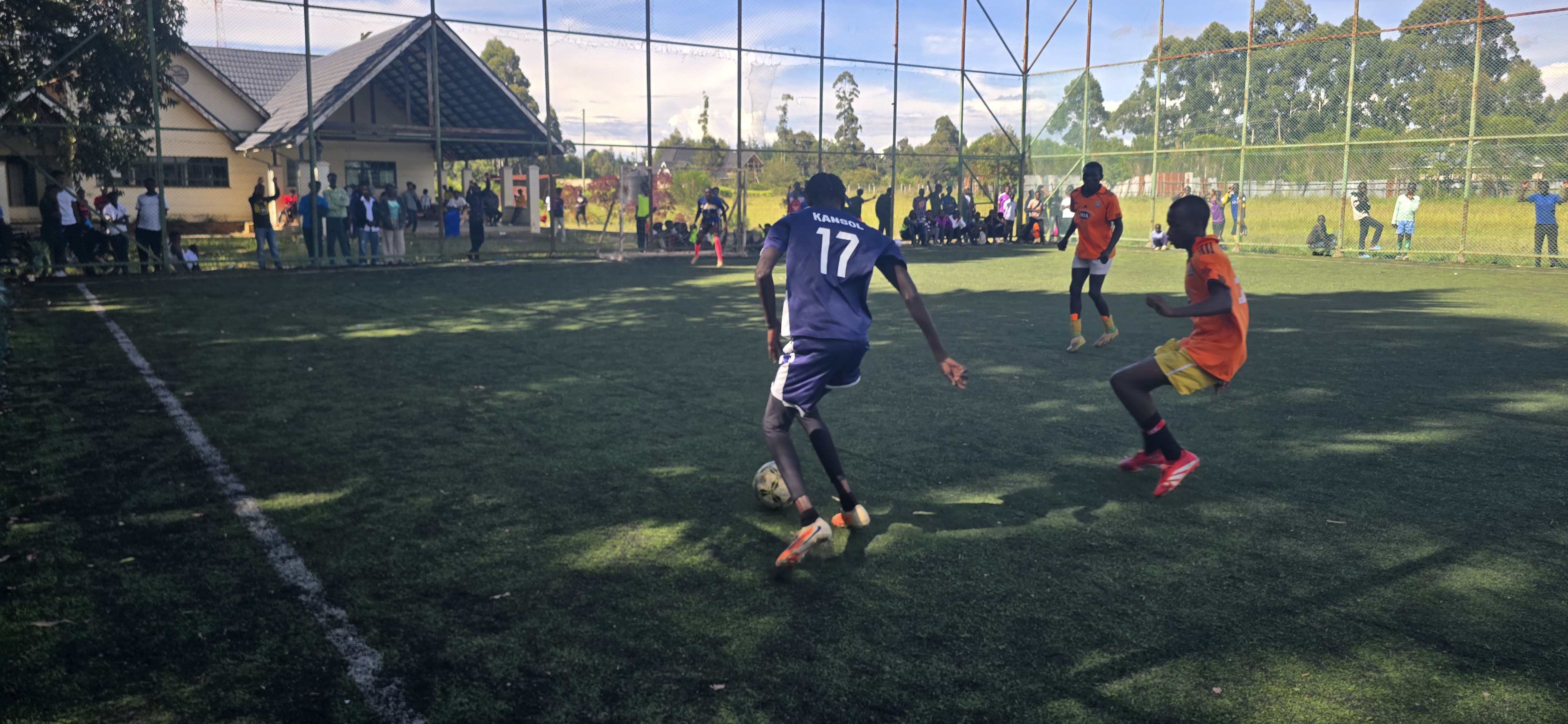 Player #17 dribbling past opponent during a tournament match