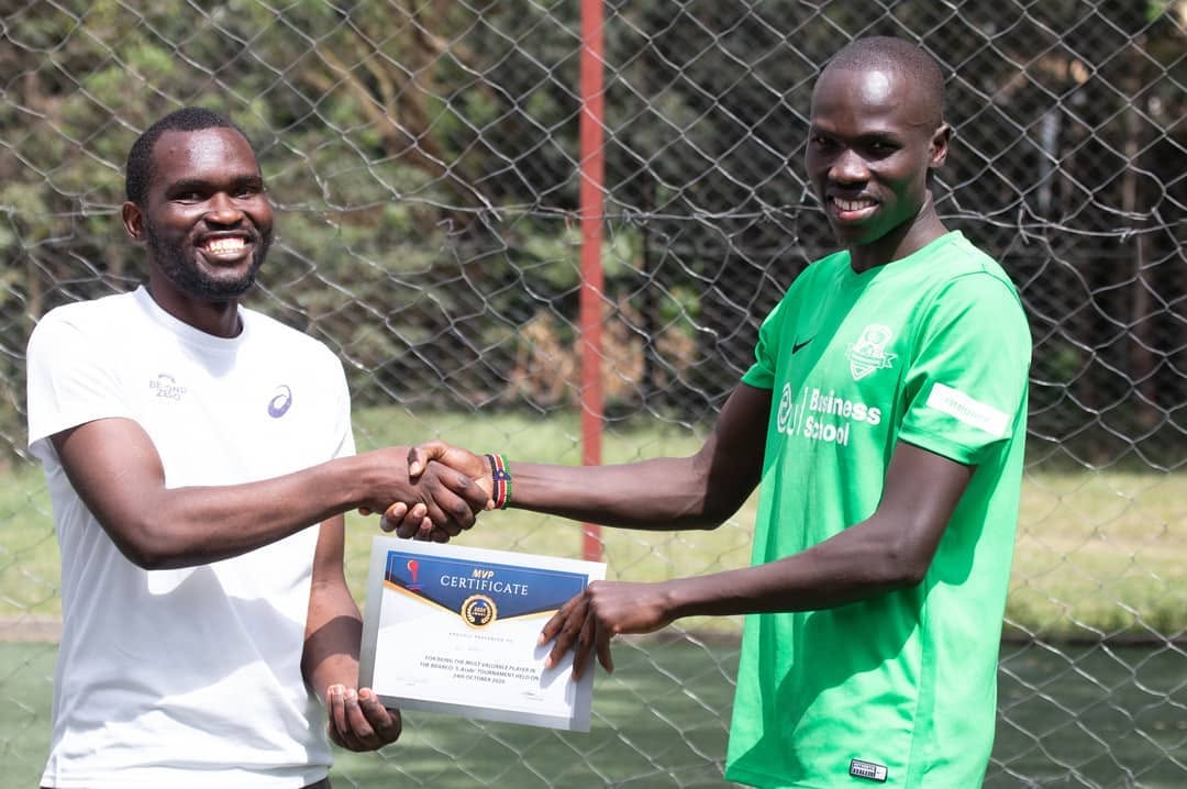 Founder handing over prize to a tournament player